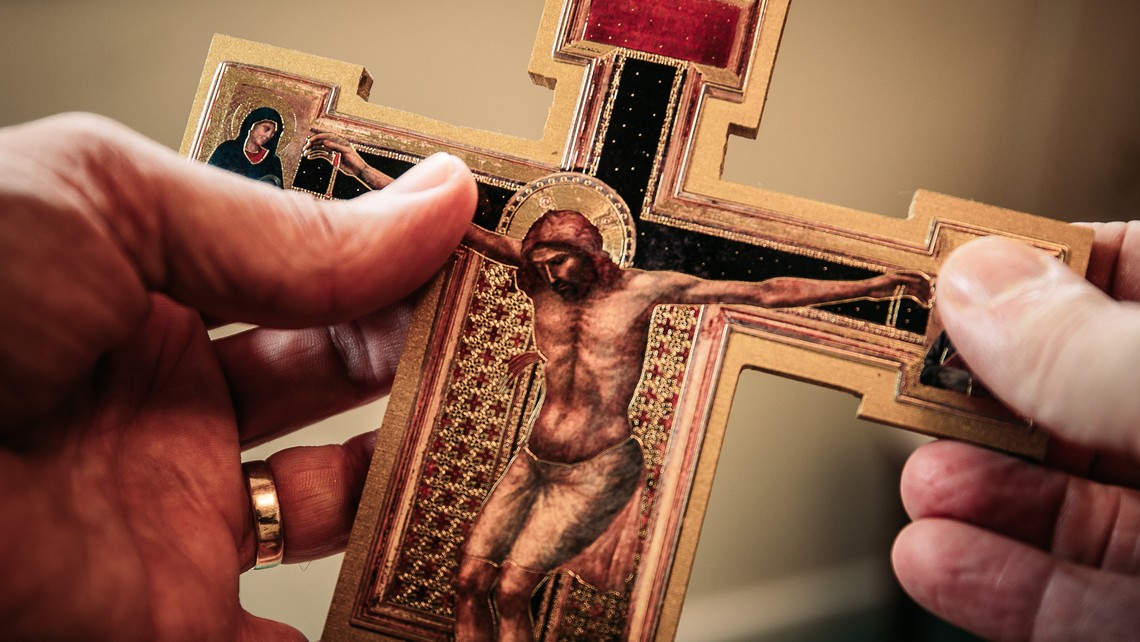 Hands holding a crucifix
